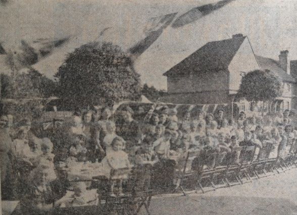 children having tea in Edward Road for VJ day 1945