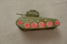 a small green wooden tank