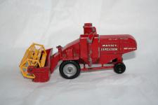 a red die cast matchbox combine harvester, the operative is missing and the paint is slightly chipped