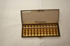 a snap case containing 11 rows of 5 beads forming a portable abacus