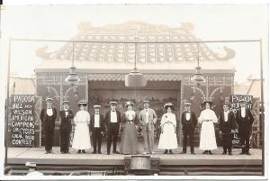 Entertainers can be seen standing on a stage