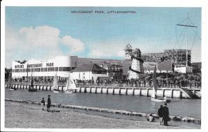 A postcard image of the River Arun with Butlins amusement park in the background. The rollercoaster and slide can be seen.